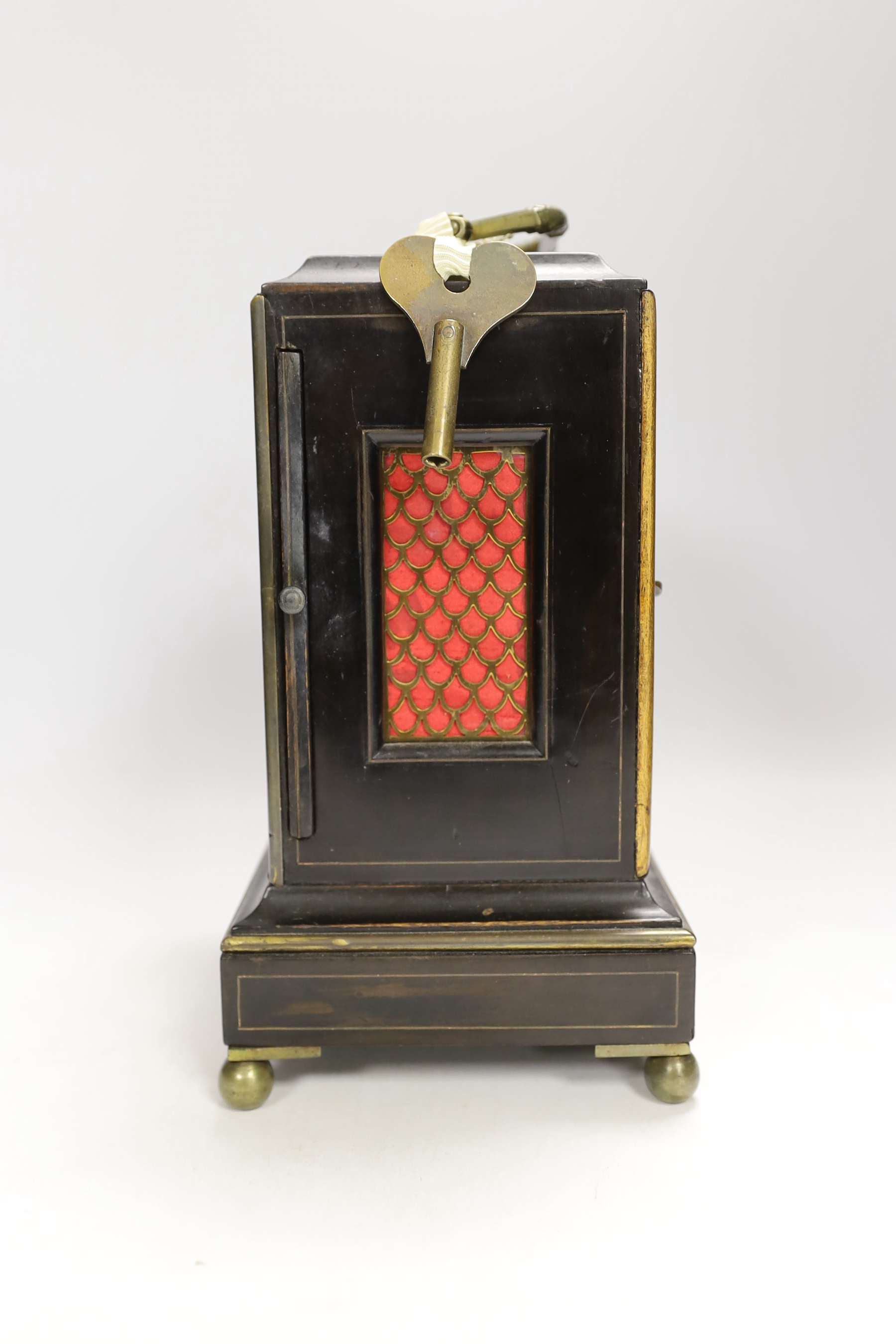 A mantel timepiece with balance escapement, silvered dial and ebonised case, 24cm